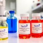 All check vials of TeSR™ feeder-free pluripotent stem cell media in a sterile lab setup.